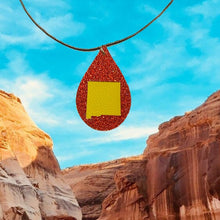 Load image into Gallery viewer, Red faux leather double sided teardrop with yellow nm state shape necklace 
